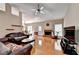 Open living room featuring hardwood floors, a fireplace, and ample natural light, perfect for gatherings at 2694 Sterling Dr, Lawrenceville, GA 30043