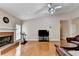 Inviting living room with a cozy fireplace, hardwood floors, and ample space for relaxation and entertaining at 2694 Sterling Dr, Lawrenceville, GA 30043