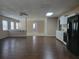Spacious living room with hardwood floors, lots of natural light and an adjacent kitchen at 2694 Sterling Dr, Lawrenceville, GA 30043
