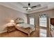 Spacious main bedroom boasts a tray ceiling, wood floors, and ample natural light from large windows at 2694 Sterling Dr, Lawrenceville, GA 30043