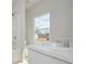 Bright bathroom with a shower, tub, and white vanity at 48 Deer Pl, Villa Rica, GA 30180