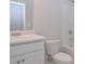 Neat white bathroom including a standard white toilet, a marble countertop, and a bathtub with shower at 48 Deer Pl, Villa Rica, GA 30180