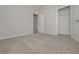 Bright carpeted bedroom, a single window, and entrances to a closet and bathroom at 48 Deer Pl, Villa Rica, GA 30180