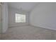 A bedroom with fresh paint and plush carpeting offers comfort and a neutral palette at 48 Deer Pl, Villa Rica, GA 30180