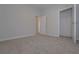 A bedroom with fresh paint and plush carpeting offers comfort and a neutral palette at 48 Deer Pl, Villa Rica, GA 30180