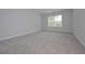 Spacious bedroom with plush carpeting, a bright window, and neutral paint at 48 Deer Pl, Villa Rica, GA 30180