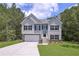 Charming two-story home featuring a two-car garage and inviting front porch at 48 Deer Pl, Villa Rica, GA 30180