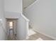 Bright hallway features hardwood floors, access to the front door, and staircase leading to upper level at 48 Deer Pl, Villa Rica, GA 30180