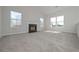 Spacious living room with vaulted ceiling, fireplace, and ample natural light from large windows at 48 Deer Pl, Villa Rica, GA 30180
