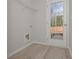 Mud room with vinyl floor, utility connections, and access door at 48 Deer Pl, Villa Rica, GA 30180