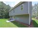 Side view of the home showcasing its spacious lot and landscaping at 48 Deer Pl, Villa Rica, GA 30180