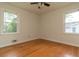 Cozy bedroom featuring hardwood floors, natural light, and neutral walls at 2118 Allaire Ne Ln, Atlanta, GA 30345