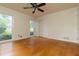 Bright bedroom featuring hardwood floors, natural light, and a ceiling fan at 2118 Allaire Ne Ln, Atlanta, GA 30345