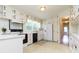 Well-lit kitchen featuring white cabinetry, black appliances, and a window over the sink at 2118 Allaire Ne Ln, Atlanta, GA 30345