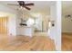 Open kitchen with white cabinetry, an island, hardwood floors, and modern appliances at 2118 Allaire Ne Ln, Atlanta, GA 30345