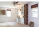 Bright office space with a brick pillar, built-in shelves, and neutral carpet at 2118 Allaire Ne Ln, Atlanta, GA 30345