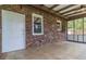 Relax on this patio with brick siding and a screen door to enjoy indoor/outdoor living at 2118 Allaire Ne Ln, Atlanta, GA 30345
