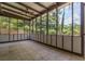 Screened patio features tile floor, ceiling fan, and views of the fenced backyard at 2118 Allaire Ne Ln, Atlanta, GA 30345