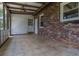 Covered patio with brick exterior, tile floor and access to the backyard create the perfect outdoor space at 2118 Allaire Ne Ln, Atlanta, GA 30345
