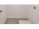 Laundry room with vinyl flooring and utility sink at 215 Amberjack Trail, Covington, GA 30016