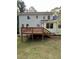 Wooden back deck featuring stairs to the yard, wood railings, and support beams at 5142 Fawn Sw Ln, Conyers, GA 30094
