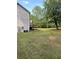 A view of the backyard showing the back of the home and a wooden deck at 5142 Fawn Sw Ln, Conyers, GA 30094