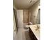 Cozy bathroom with a tub and shower, toilet and vanity at 5142 Fawn Sw Ln, Conyers, GA 30094