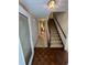 Inviting foyer with hardwood floors and staircase leading to the upper level at 5142 Fawn Sw Ln, Conyers, GA 30094