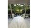View from the porch overlooking the lush green yard and trees, providing a serene setting at 5142 Fawn Sw Ln, Conyers, GA 30094