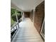 Spacious porch with brick accents, white railings, and ample space for outdoor seating at 5142 Fawn Sw Ln, Conyers, GA 30094