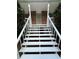 Close up of the front porch steps with white railings, offering a welcoming entry at 5142 Fawn Sw Ln, Conyers, GA 30094