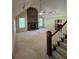 Bright living room with high ceilings features a striking stone fireplace and staircase at 5142 Fawn Sw Ln, Conyers, GA 30094