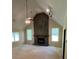 Bright living room features high ceilings and a striking stone fireplace at 5142 Fawn Sw Ln, Conyers, GA 30094