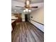 Open floor plan between the living room and kitchen with new wood-look flooring at 5142 Fawn Sw Ln, Conyers, GA 30094