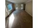 Spacious living room featuring neutral carpeting and expansive windows, offering scenic views at 5142 Fawn Sw Ln, Conyers, GA 30094
