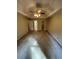 Spacious main bedroom with a ceiling fan, neutral walls, and access to the closet and bathroom at 5142 Fawn Sw Ln, Conyers, GA 30094