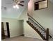 A view of the home's staircase, open living room and entryway at 5142 Fawn Sw Ln, Conyers, GA 30094