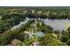 Aerial community view with tennis courts, swimming pool, and lake at 7994 Larksview Dr, Fairburn, GA 30213