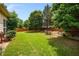 Lush green backyard with a well-maintained lawn and privacy fence at 7994 Larksview Dr, Fairburn, GA 30213