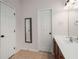 Bathroom with a large countertop, lots of lighting, and white cabinets at 7994 Larksview Dr, Fairburn, GA 30213