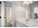 Bathroom with a shower-tub combo and single vanity with a clean design at 7994 Larksview Dr, Fairburn, GA 30213