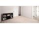 Bedroom featuring neutral carpet, fresh paint, and storage with a large closet at 7994 Larksview Dr, Fairburn, GA 30213