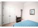 Bedroom featuring an electric fireplace and closet with double doors at 7994 Larksview Dr, Fairburn, GA 30213