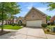 Charming brick home featuring a two-car garage and driveway at 7994 Larksview Dr, Fairburn, GA 30213