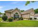 Charming brick home featuring a well-manicured lawn at 7994 Larksview Dr, Fairburn, GA 30213