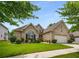 Well maintained brick home with mature landscaping and a side entry garage at 7994 Larksview Dr, Fairburn, GA 30213