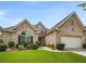Beautiful brick home with lush landscaping and a two-car garage at 7994 Larksview Dr, Fairburn, GA 30213
