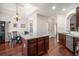 Spacious kitchen with center island, stainless steel appliances, and hardwood flooring at 7994 Larksview Dr, Fairburn, GA 30213