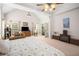Spacious main bedroom with a vaulted ceiling, sitting area, and french doors at 7994 Larksview Dr, Fairburn, GA 30213