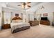 Large bedroom featuring a vaulted ceiling, ceiling fan, and ample natural light at 7994 Larksview Dr, Fairburn, GA 30213